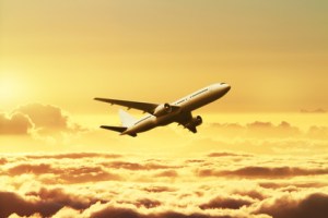 Airplane in the sky at sunset